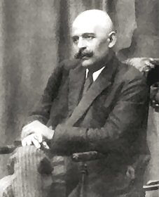 george Gurdjieff in black coat and bald head
