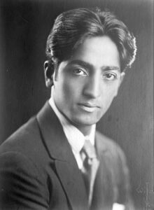 young j krishnamurthy in black suit black and white