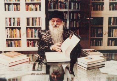 osho reading book in library color photograph